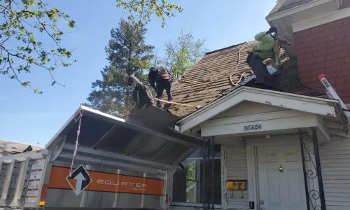 Men stand on the roof and measure it
