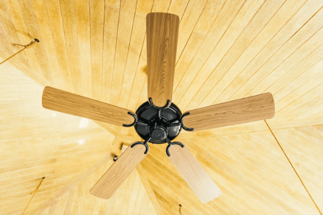 A roof vent fan providing air circulation in an attic