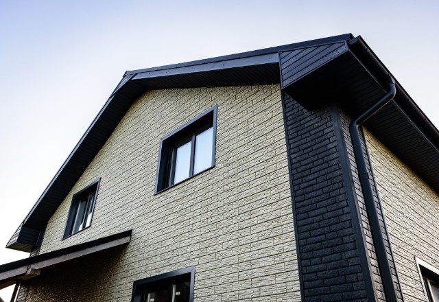 An array of different types of siding materials, such as wood, aluminum, and stone
