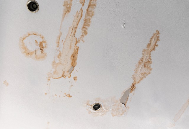 Water stains on the ceiling are the typical sign of a roof leak