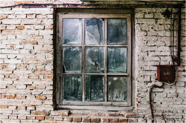Image of an old, drafty window