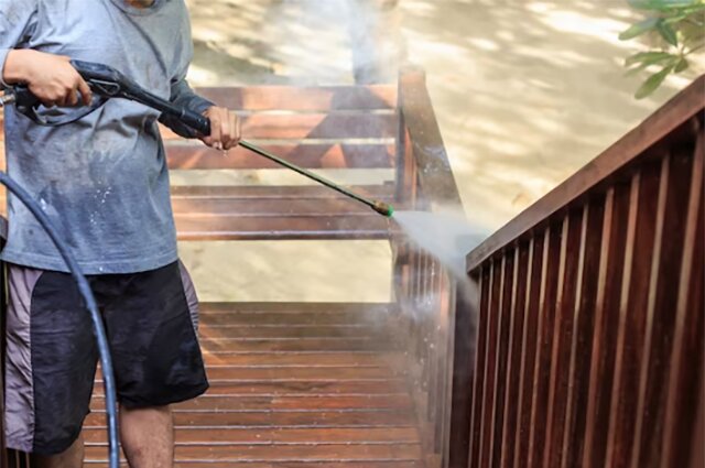 Pressure Wash the Damaged Area with Warm Water and Detergent