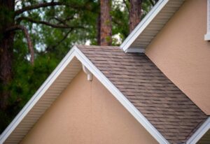 A picture of a house with an asphalt shingle roof - Asphalt shingle roofs are durable and can last up to 30 years when maintained properly.