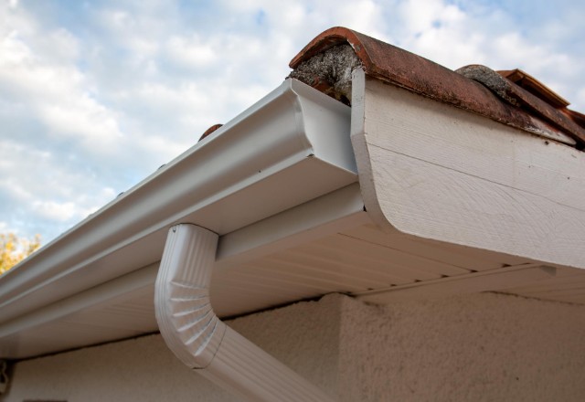 Excessive granules entering the downspout due to wear-and-tear of asphalt shingles
over time.