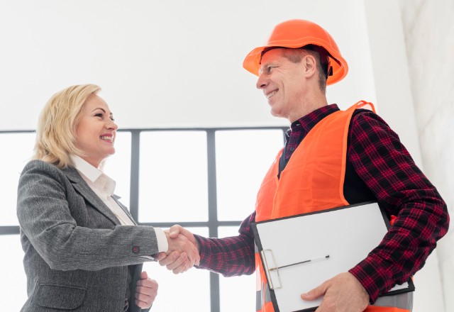 A man discussing insurance policies with an agent: An experienced broker can help
contractors access the coverage they need for their business.