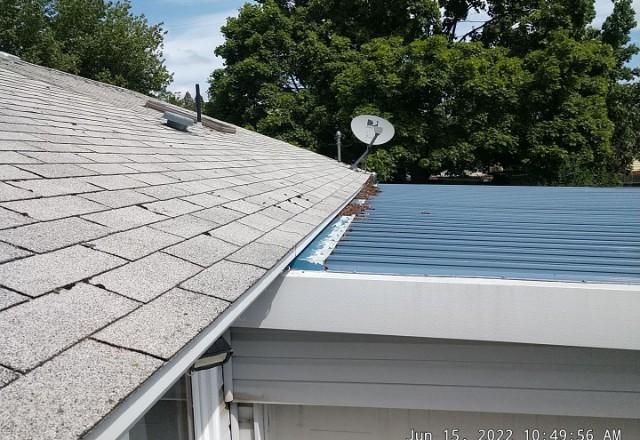 Portfolio of Advance Roofing LLC: a falt metal roof and sloped asphalt roof before renovation