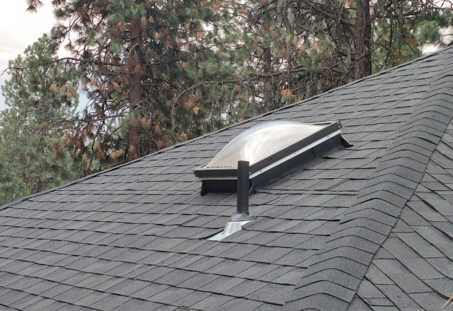 Skylight installed on a shingle roof