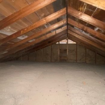 An attic in Spokane, showing insufficient insulation